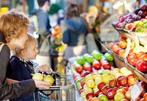 mom and child shopping for fruit