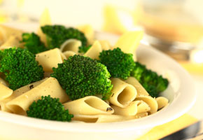 a plate of broccolli and pasta