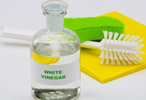 vinegar bottle with cleaning tools