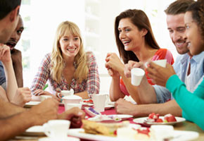 a group of people enjoying dinner