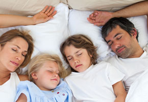 Loving Family Sleeping Together