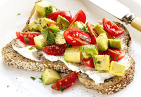 Toast with cream cheese, avocado and cherry tomatoes