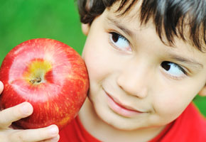a boy with an apple