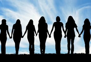 Silhouette of women, walking hand in hand