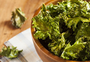 kale chips in a wooden bowl