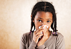 a girl sneezing