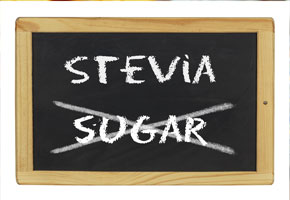 a blackboard with the words stevia and sugar written on it with the word sugar crossed out