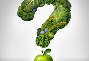 Green diet questions concept as a group of fresh fruit and vegetables in the shape of a question mark as a symbol of good high fiber healthy eating and information on natural nutrition.