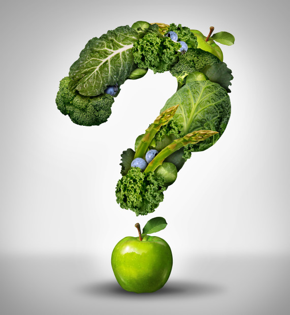 Green diet questions concept as a group of fresh fruit and vegetables in the shape of a question mark as a symbol of good high fiber healthy eating and information on natural nutrition.