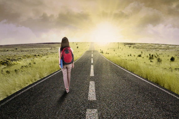 Female college student walk on the road to start her journey and gain bright future